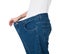 Woman Showing Her Old Jeans After Successful Diet