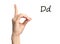 Woman showing letter D on background, closeup. Sign language