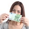 Woman showing a one hundred euros banknote