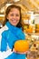 Woman showing round cheese
