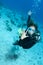 Woman shows off her wedding ring on a dive