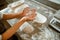 Woman shows palms covered with flour in contemporary craft bakery shop