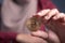 Woman Shows Physical Bitcoin Cryptocurrency