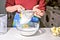 Woman sifting flour through sieve