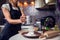 Woman sifting flour through sieve. Selective focus