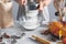 Woman sifts flour using sieve into glass bowl