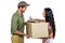 Woman signing for pack delivery with smiling postman