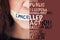 Woman, silence and tape on mouth with words to voice gender based violence, protest or message. Female lips sealed or