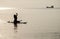 Woman silhouette against sunset sea