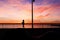 Woman silhouette in La Barceloneta beach at sunrise, Barcelona . Spain