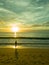 woman silhouette using a smart phone at sunset on the beach in phuket, Thailand