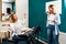 Woman singer rehearsing her song on a lesson with a teacher