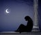 Woman sit near the column and wait somebody under the moon light, lonely date, sad girl waits somebody, scene,