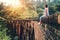 Woman sits on the Demodara nine arches bridge the most visited s