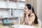 Woman sits happily listening to music in a private office