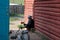 Woman sitted in front of her house, Ihtamir, Mongolia.