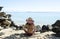 Woman sitting on beach wearing hat