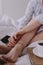 Woman sitting in bed with breakfast