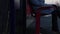 Woman sitting on bench in empty train station