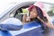 Woman sitting in the car lipstick makeaup.