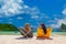 Woman sitting on a chair at the beach