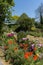 Woman sitting on a deckchair in a country garden.