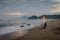 A woman is sitting and enjoying the moment on Karang Hawu Beach, West Java, Indonesia