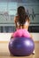 Woman sitting on fitness ball