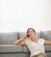 Woman sitting on floor and speaking cell phone