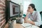 Woman sitting in front of working computer