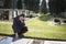 Woman sitting at grave