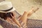 Woman sitting in a hammock on the beach