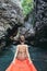 Woman sitting in kayak in the tropical calm lagoon