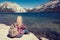 Woman sitting at a lake in Yosemite Park. wanderlust concept