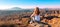 Woman sitting and looking at sunset Gorafe desert in Spain