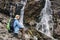 Woman sitting near Siklawa waterfall in Poland