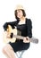 Woman sitting and playing guitar guitar folk song in her hand