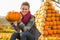 Woman sitting with pumpkin