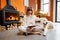Woman sitting relaxed with her dog on the floor near the fireplace and using digital tablet at home