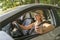 Woman sitting in a rental car on holiday vacancy