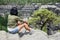 Woman sitting on a rock lookout