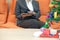 woman sitting on sofa using tablet during xmas. christmas holiday new year celebration season greetings