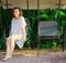 Woman sitting in swingset