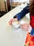 Woman sitting at table with cup of freshly made latte