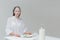 Woman sitting at the table with food