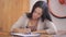 Woman sitting on table underline words in fold office