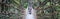 A woman sitting on wire rope bridge or suspension bridge in the jungle