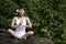 Woman sitting with Yoga style in Bali