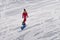 Woman skate forward on a snowboard on a mountain slope