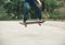 Woman skateboarding on parking lot